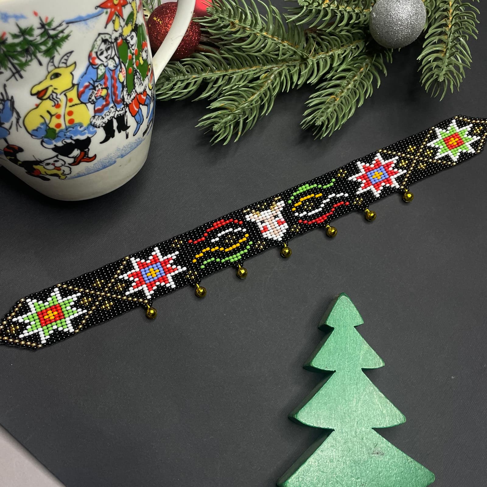 Beaded choker with a colourful goat motif on a black ground
