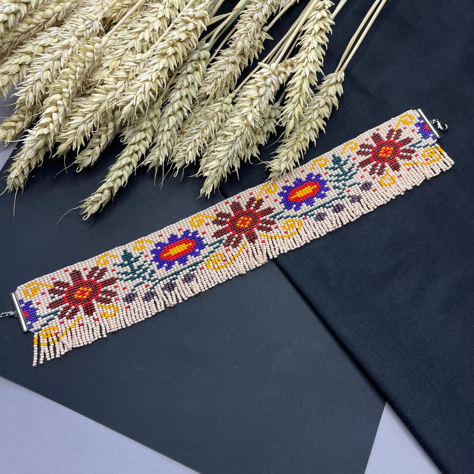 Beaded choker with large naive-style flowers