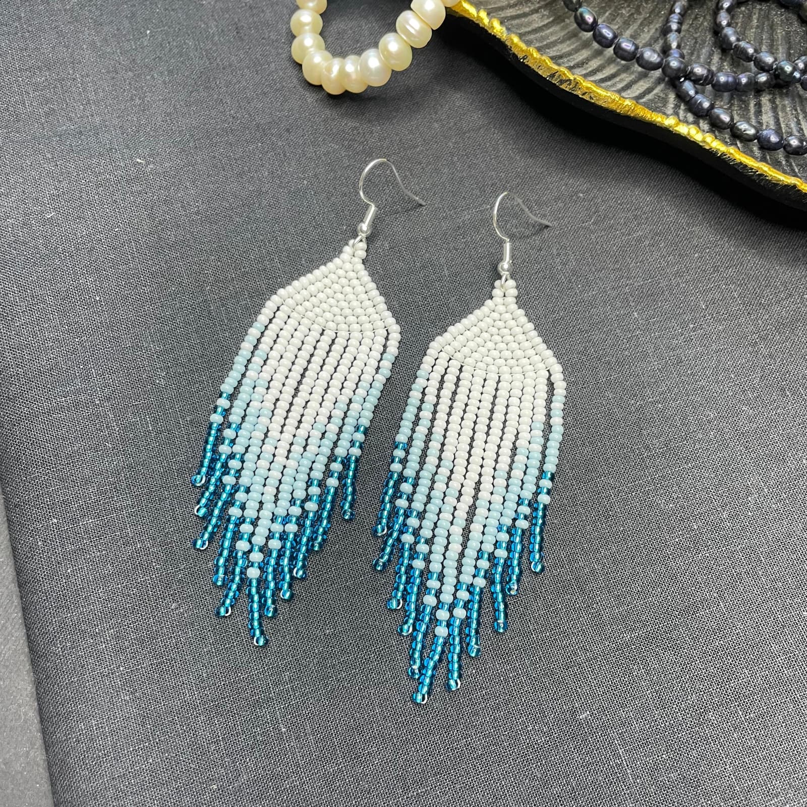 Beaded fringe earrings in a white to blue ombre gradient
