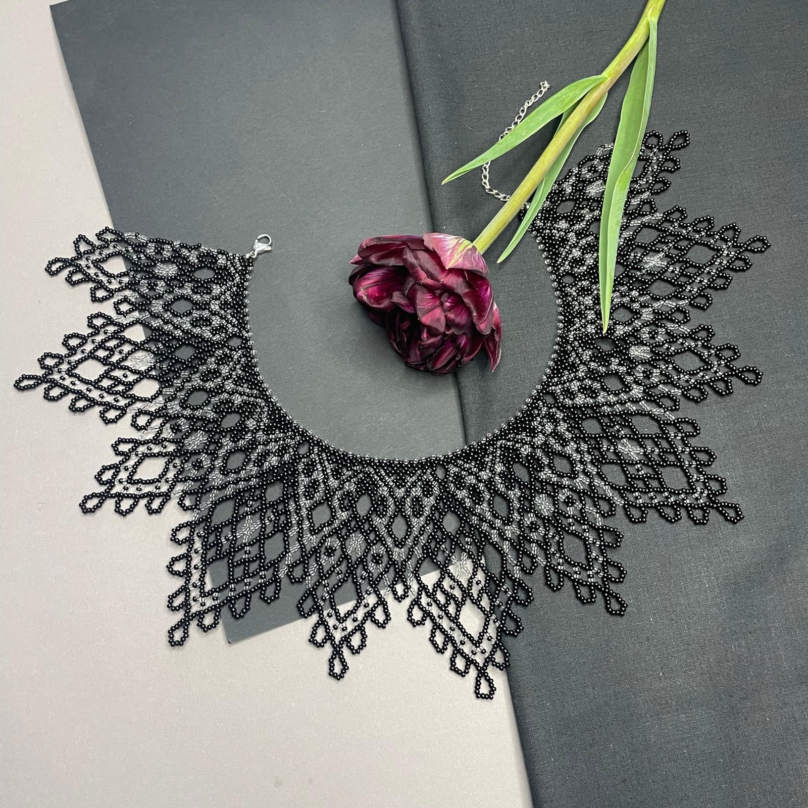 The openwork choker worn at the throat